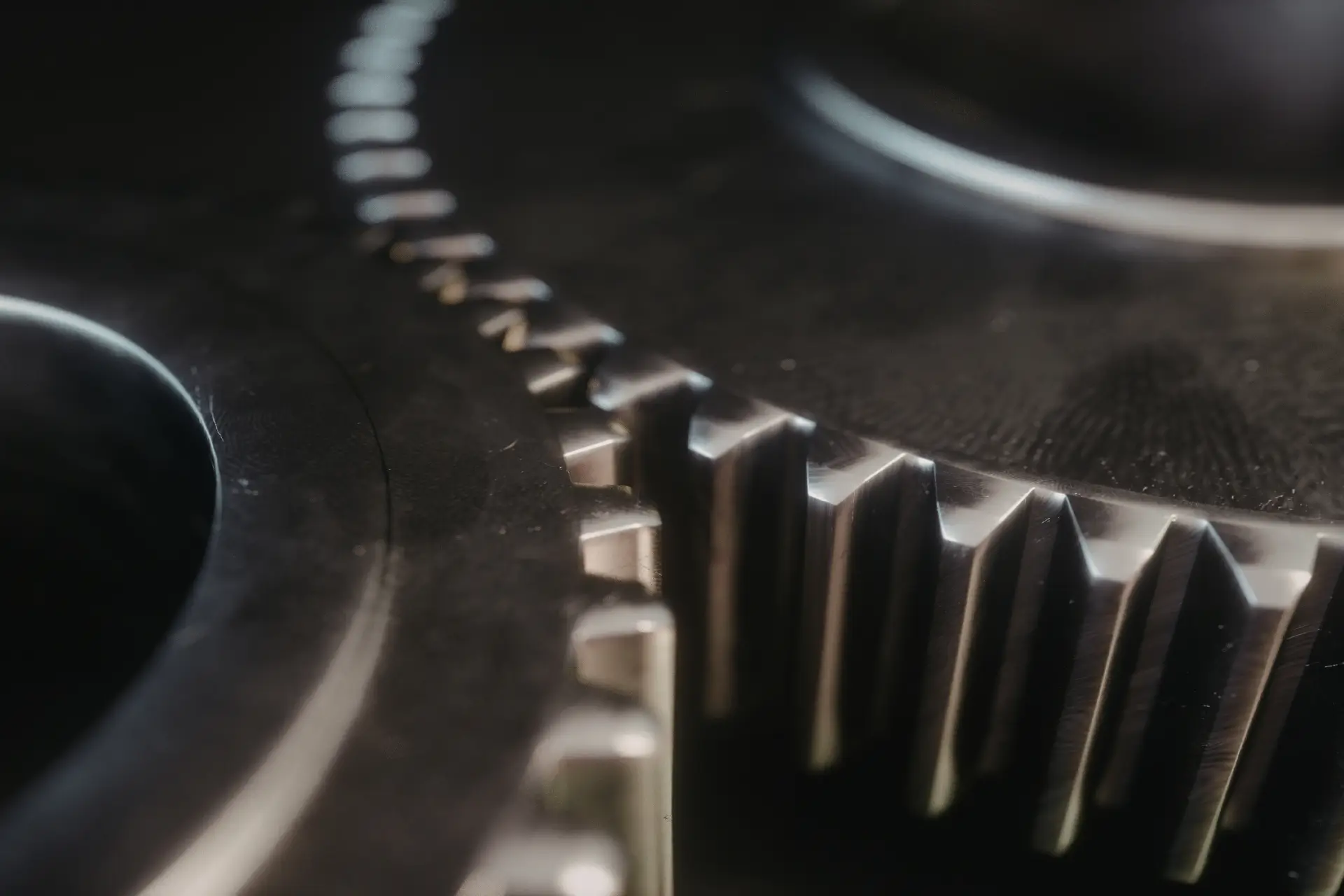 Represents an approach that relies on distinct, moving parts working together in harmony.